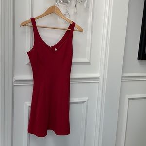 Sleeveless red dress.